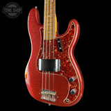 Front angle of Used 2013 Fender Custom Shop '64 Precision Bass Relic Red Sparkle over Sunburst.