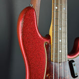 Shoulder of Used 2013 Fender Custom Shop '64 Precision Bass Relic Red Sparkle over Sunburst.