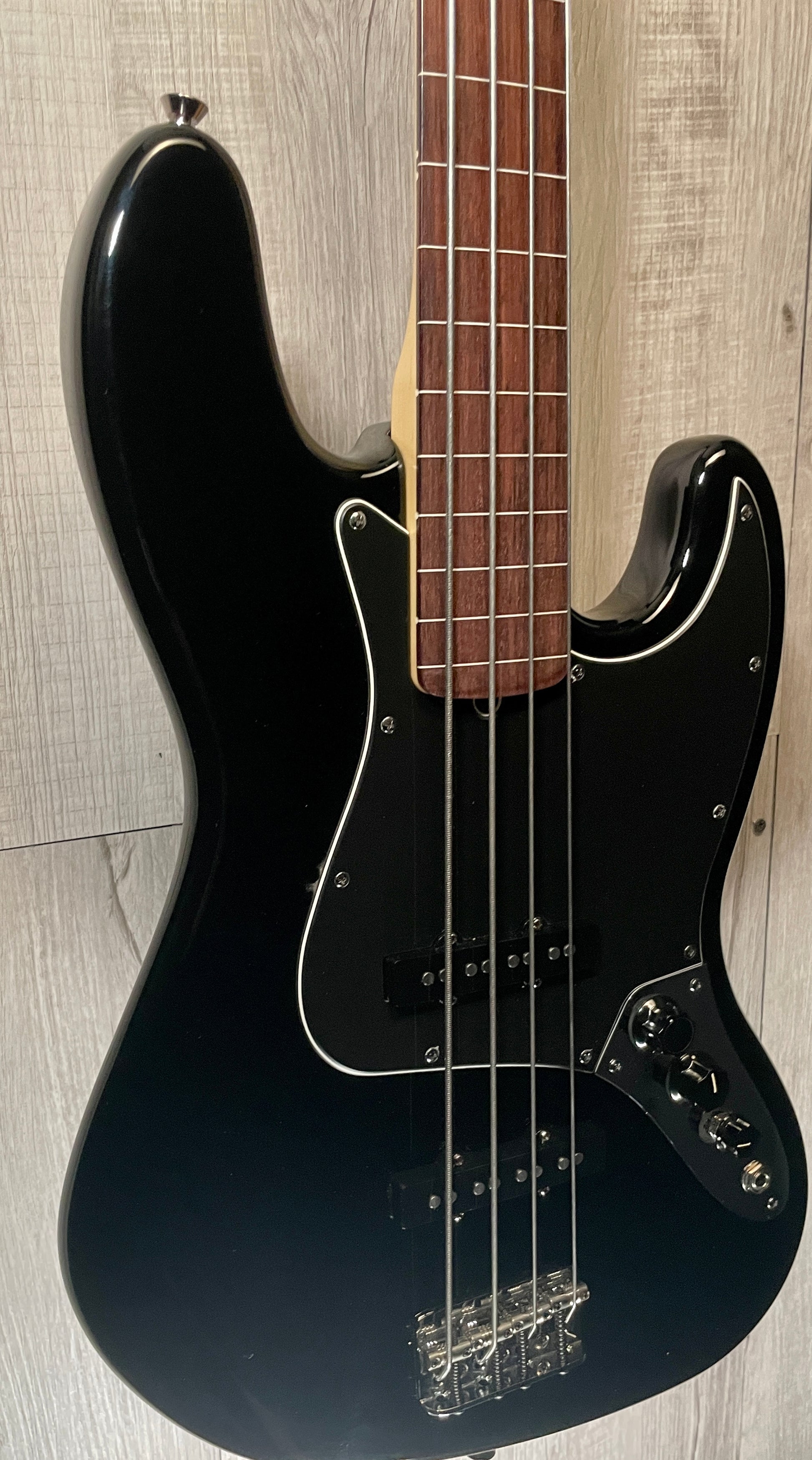 Front left of Used 2005 Fender American Jazzbass Fretless Black TSS2892.