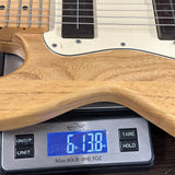 Used 1983 Peavey T-15 Natural on scale displaying weight.