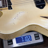 Rock N Roll Relics Lightning Jr Nicotine White Medium Aging on scale displaying weight.
