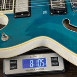 Used Hagstrom Viking Dlx Blue on scale displaying weight.