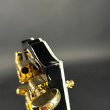 Chip on headstock for Used Gibson Custom Shop Les Paul Custom Ebony.
