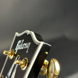 Chip on headstock for Used Gibson Custom Shop Les Paul Custom Ebony.