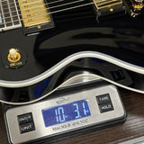 Used Gibson Custom Shop Les Paul Custom Ebony on scale displaying weight.