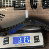 Used Godin XTSA Trans Black on scale displaying weight.