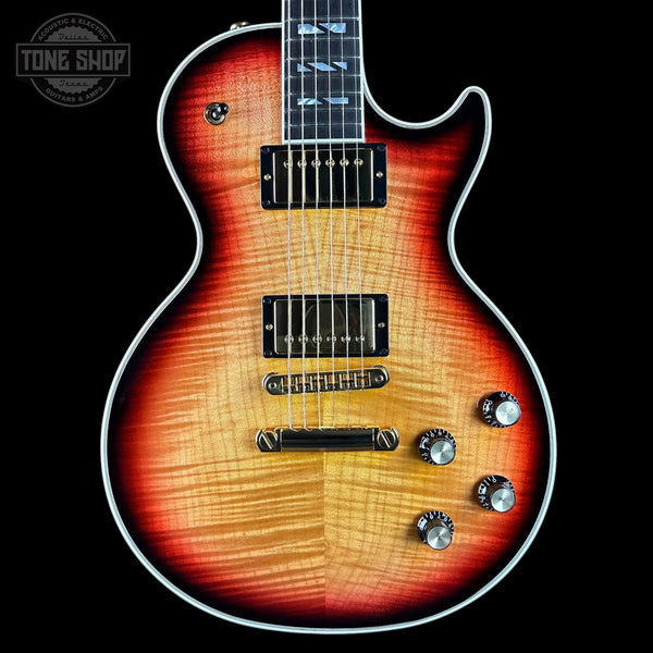 Electric guitar with a sunburst finish on a black background, featuring the Tone Shop logo.