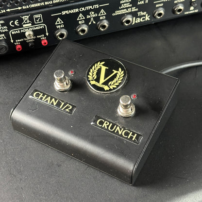 Guitar effects pedal with 'Crunch' branding on a dark surface