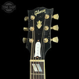 Headstock of Gibson Custom Made 2 Measure Dove Double Guard Trans Ebony Light Aged.