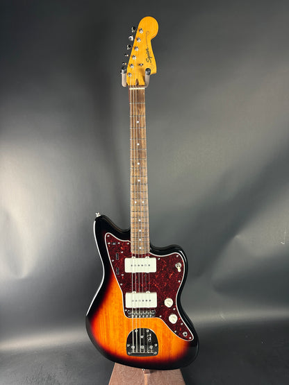 Electric guitar with a sunburst finish on a gray background
