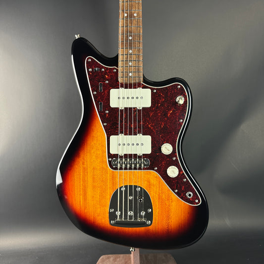 Electric guitar with a sunburst finish on a gray background