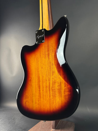 Guitar body with sunburst finish on a gray background