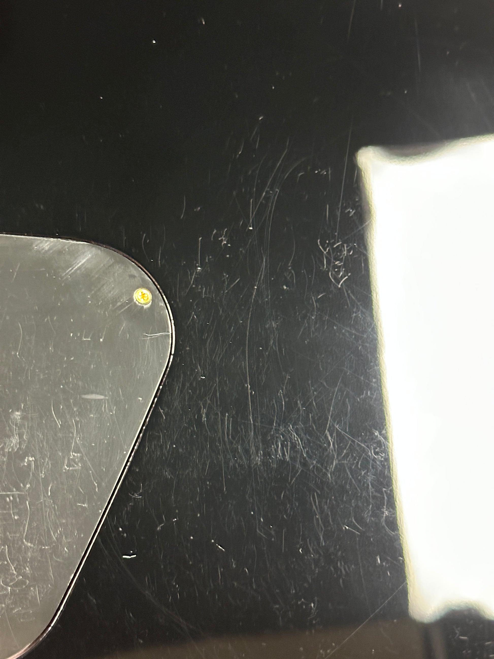 Scratches on back of Gretsch G6131T-62 Vintage Select Duo Jet Firebird Red.