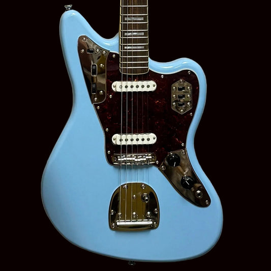 Light blue electric guitar on a light gray background