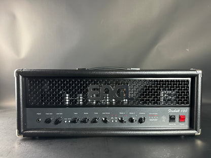 Fender guitar amplifier head on a reflective surface with a gray background