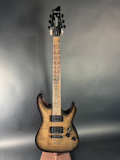 Electric guitar with a sunburst finish on a gray background