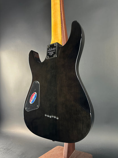 Guitar body with visible brand logo on a gray background
