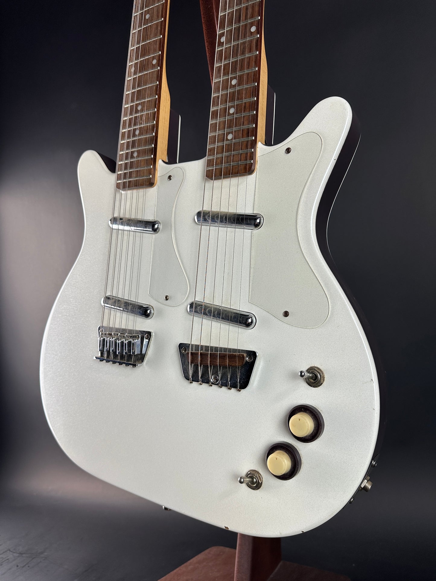 White electric guitar on a dark background