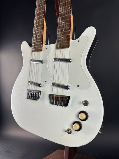 White electric guitar on a dark background
