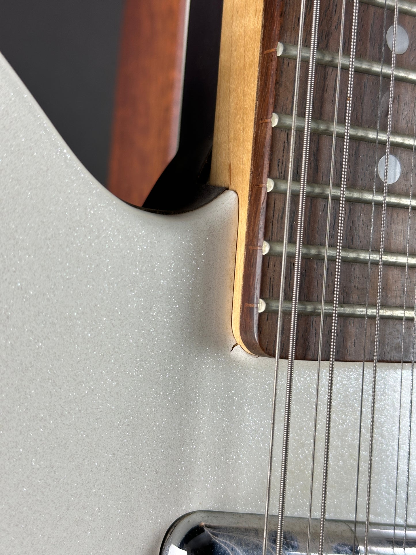 Close-up of a guitar's neck and body