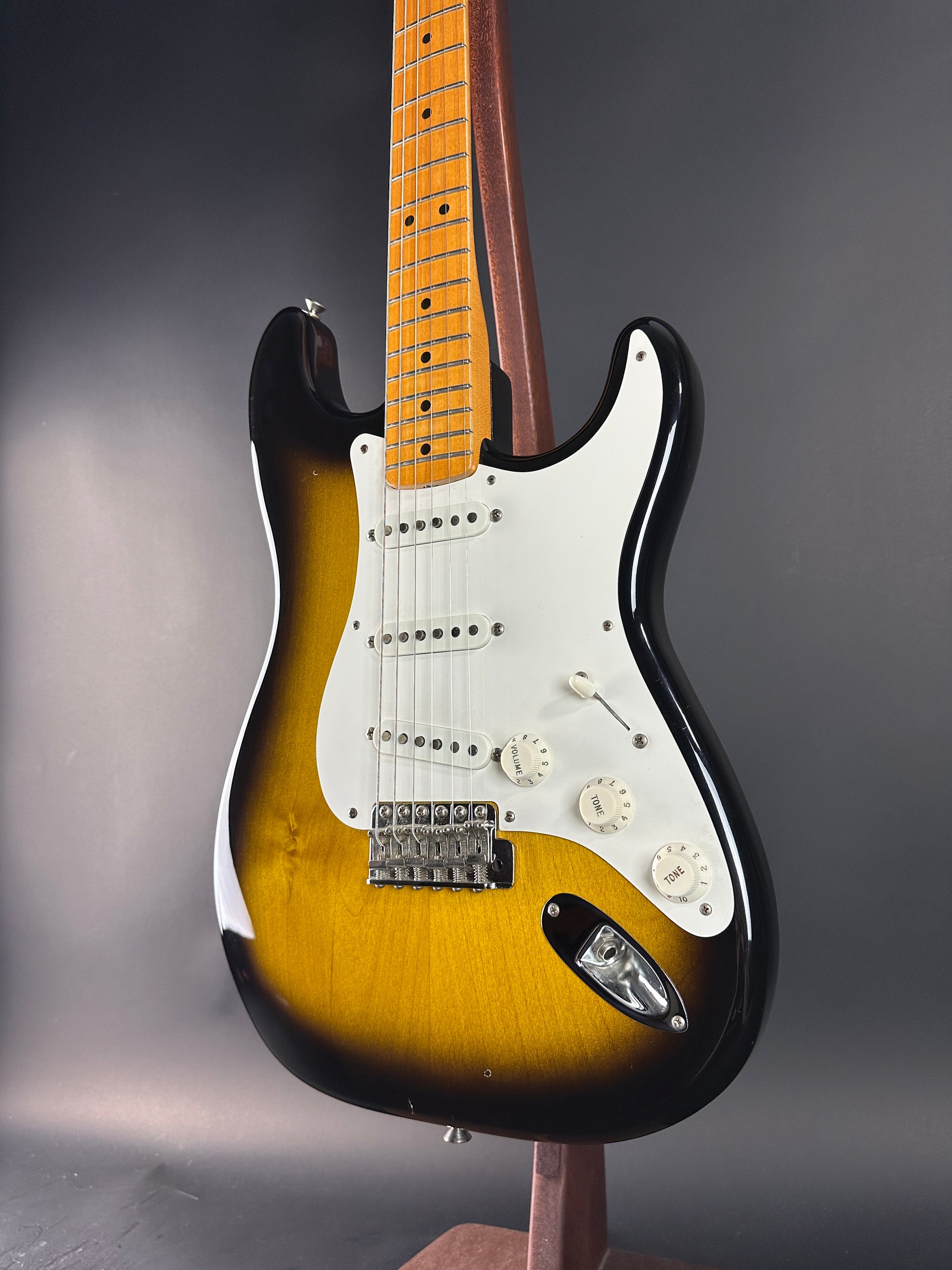 Front angle of Used 1984 Fender Fullerton 1957 Stratocaster Reissue 2-Color Sunburst.