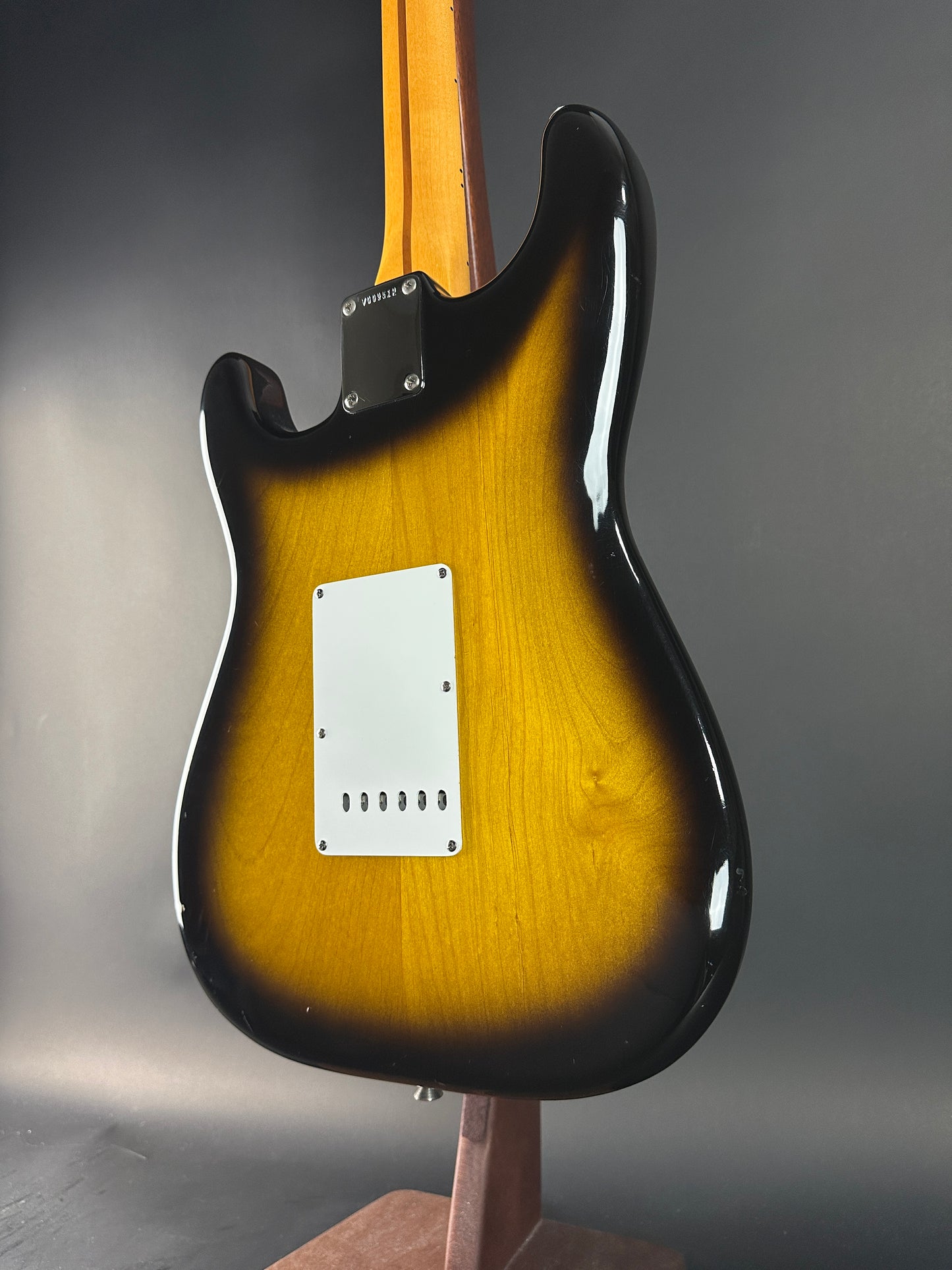 Back angle of Used 1984 Fender Fullerton 1957 Stratocaster Reissue 2-Color Sunburst.