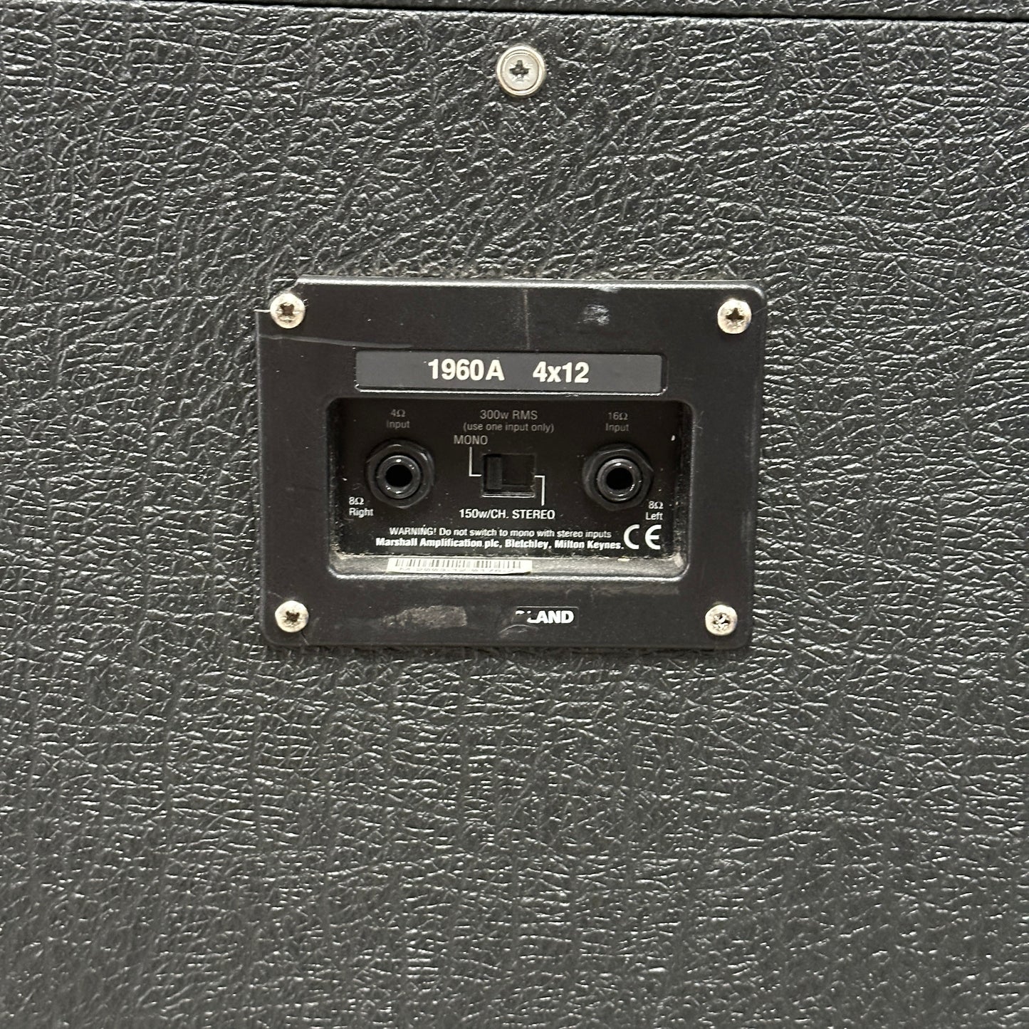 Black guitar amplifier with model number 1960A 4x12 on a textured surface