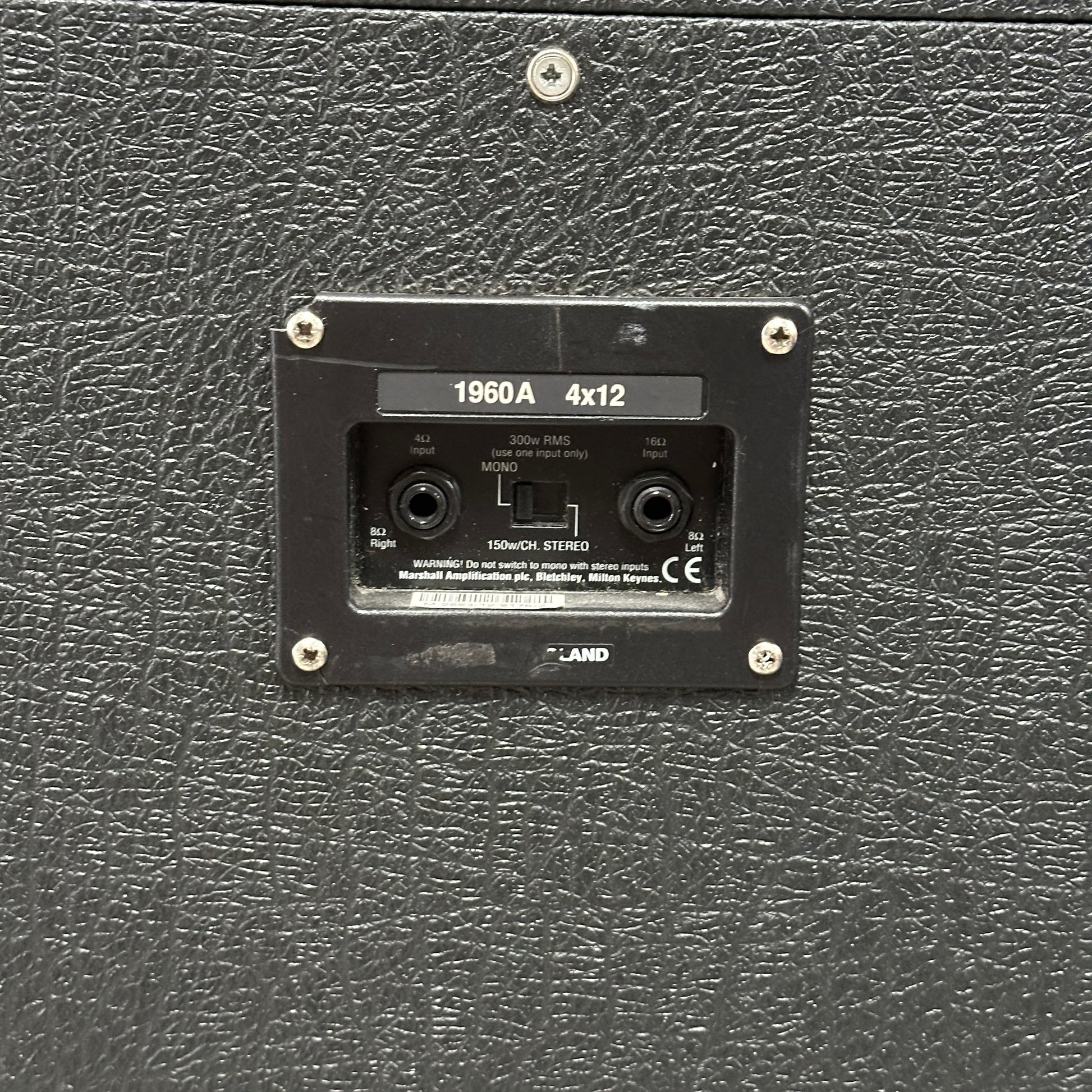 Black guitar amplifier with model number 1960A 4x12 on a textured surface
