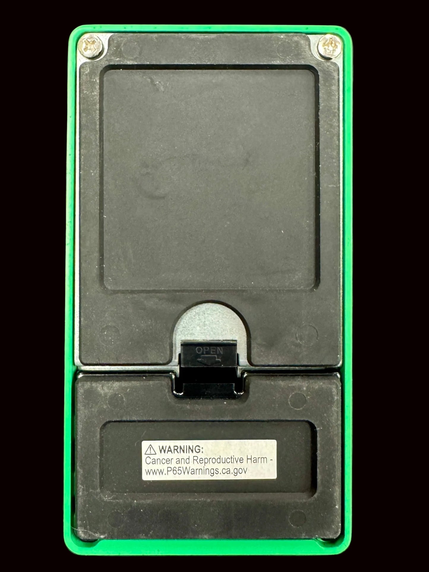 Black electronic device with green border on a gray background