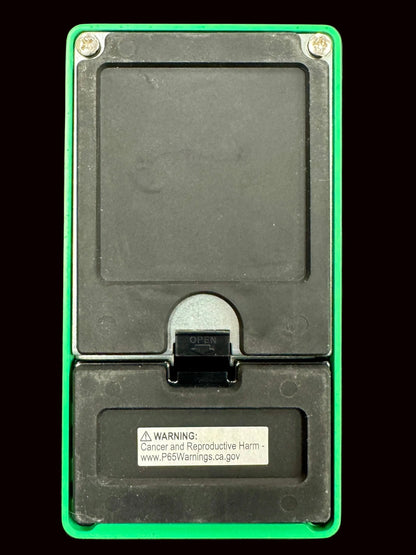 Black electronic device with green border on a gray background