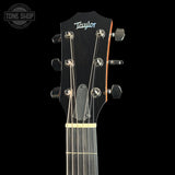 Headstock of Used 2025 Taylor Custom Tone Shop Exclusive Dread Adirondack/East Indian RW.