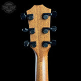 Back of headstock of Used 2025 Taylor Custom Tone Shop Exclusive Dread Adirondack/East Indian RW.