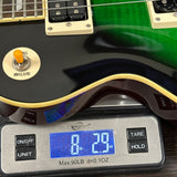 Used Epiphone Les Paul Slash Anaconda on scale displaying weight.