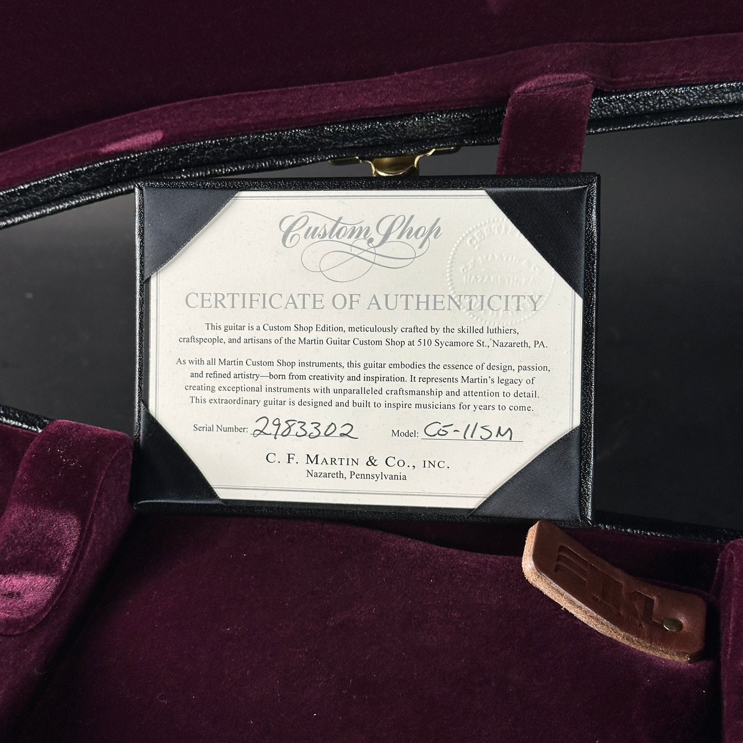 Certificate of Authenticity for a C.F. Martin guitar inside a purple case