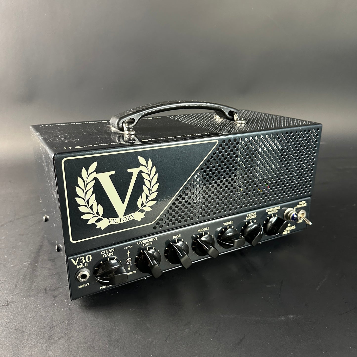 Guitar amplifier head with 'Victory' logo on a gray background