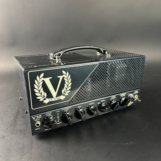 Guitar amplifier head with 'Victory' logo on a gray background