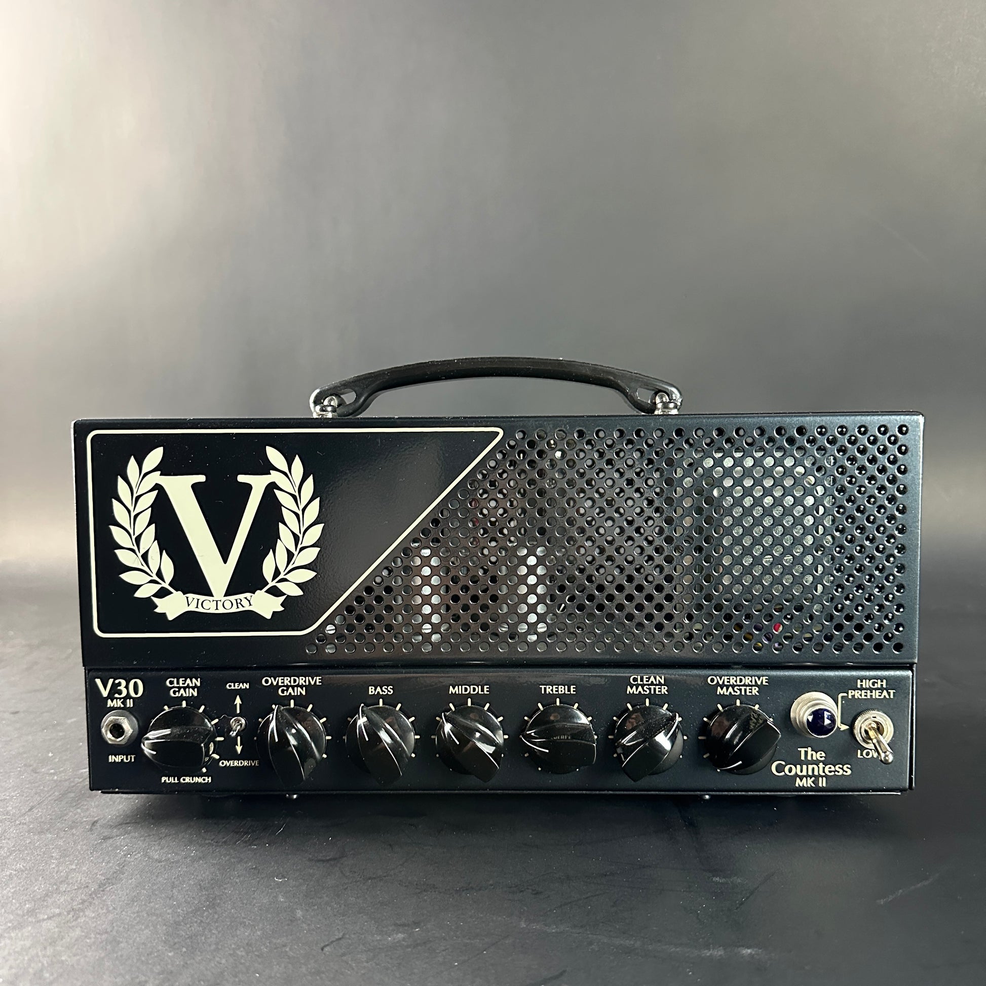 Victory guitar amplifier head with brand logo on a gray background