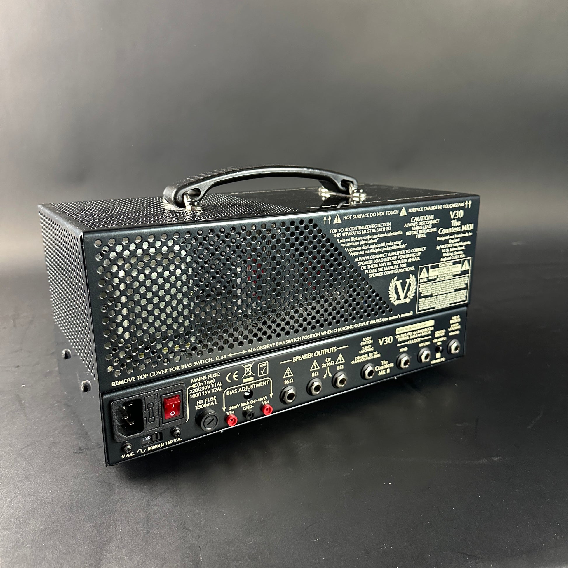 Guitar amplifier with control panel on a gray background