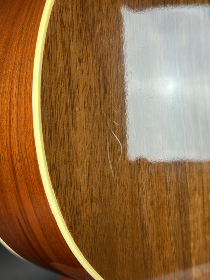 Close-up of a wooden surface with a hair strand on it