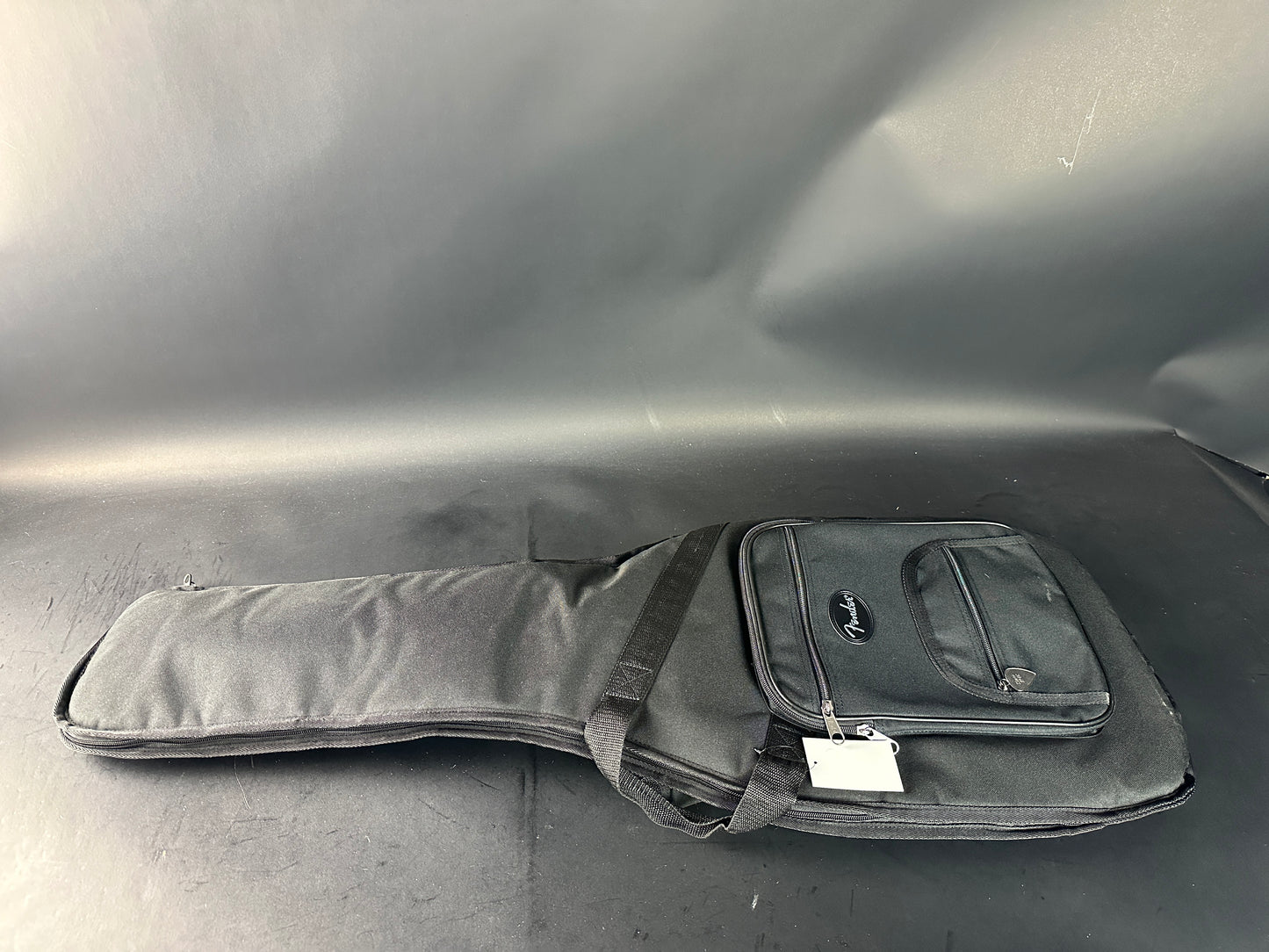 Guitar case on a gray surface
