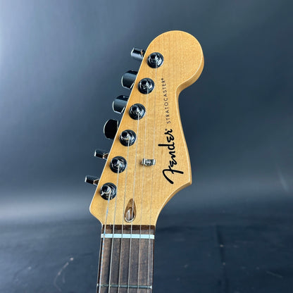 Fender Stratocaster guitar headstock on a dark background