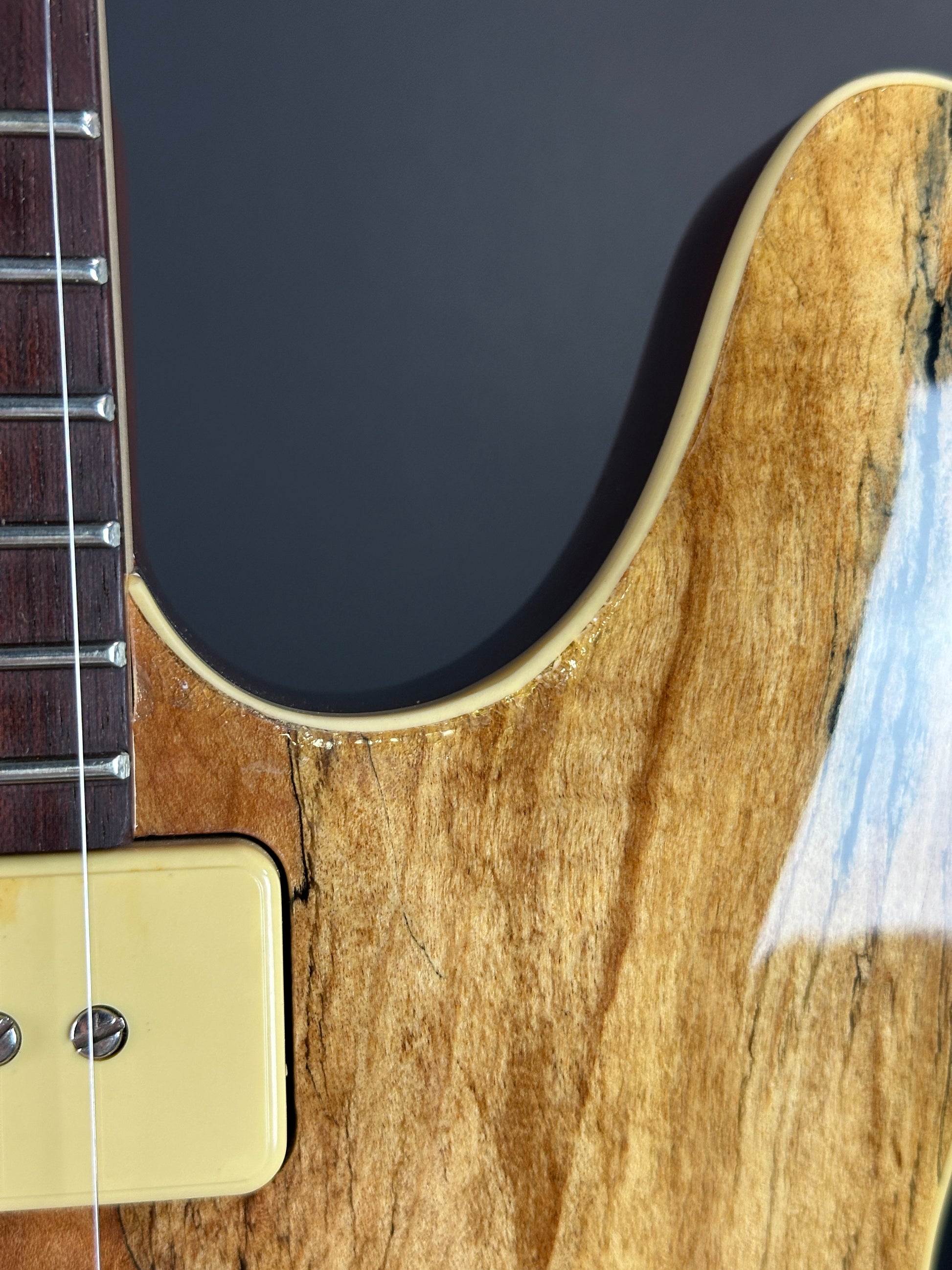 Wear near cutaway of Used Michael Kelly 59 Thinline Spalted Maple.