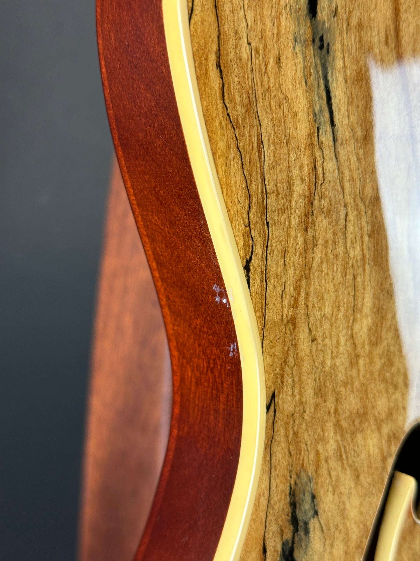Wear on side of Used Michael Kelly 59 Thinline Spalted Maple.