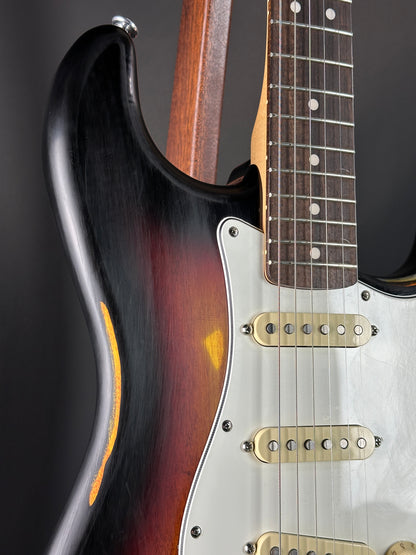 Close-up of a guitar with a focus on the neck, fretboard, and body.