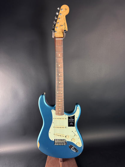 Blue electric guitar on a dark gray background