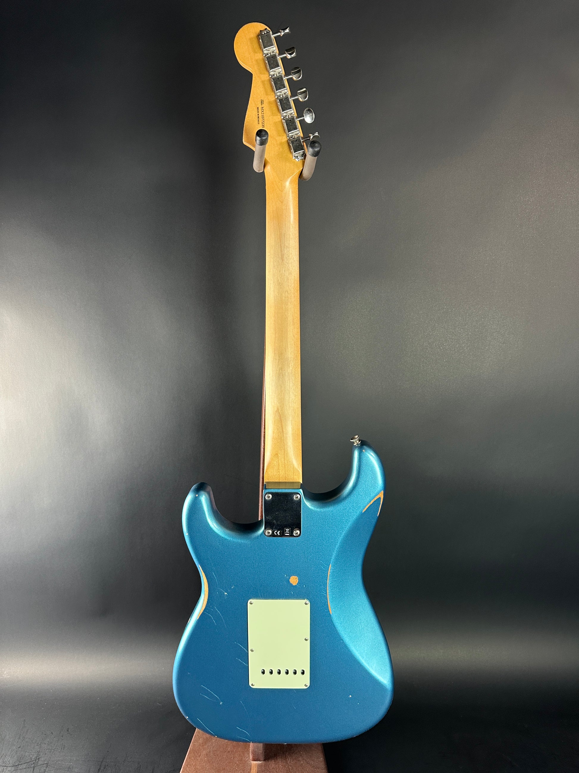 Blue electric guitar on a dark background