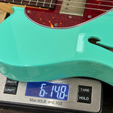 Used Suhr AH T Seafoam Green on scale displaying weight.
