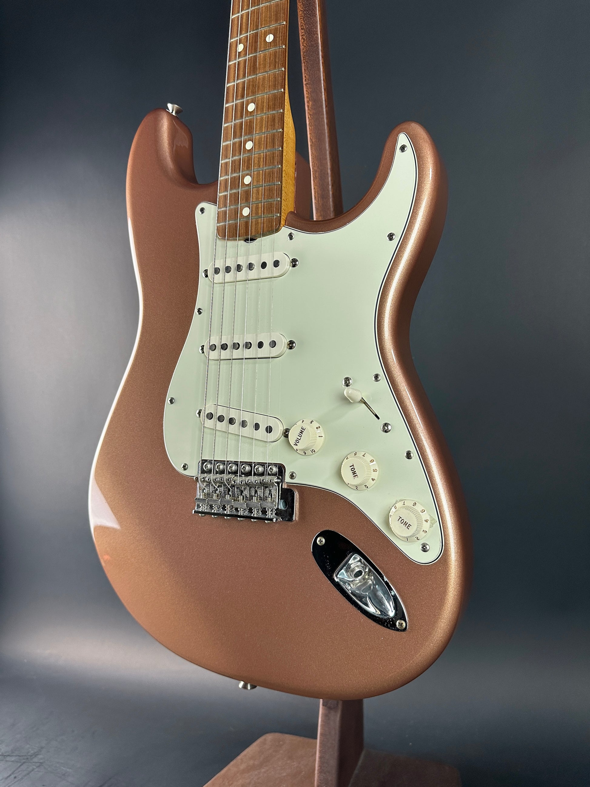 Front angle of Used 1999 Fender Classic 60s Stratocaster Burgundy Mist.