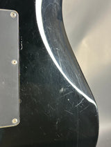 Scratched black surface with a metallic strip and screws