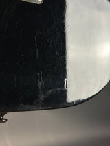 Close-up of a helmet with a metallic finish and visible wear.